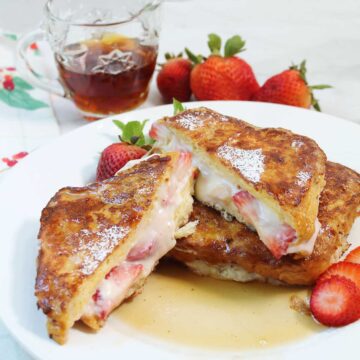 Halved French toast with warm filling showing.