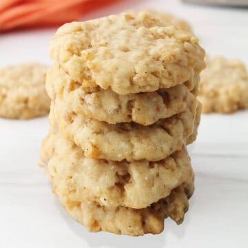 Cheddar Crackers with Rice Krispies stacked on table.