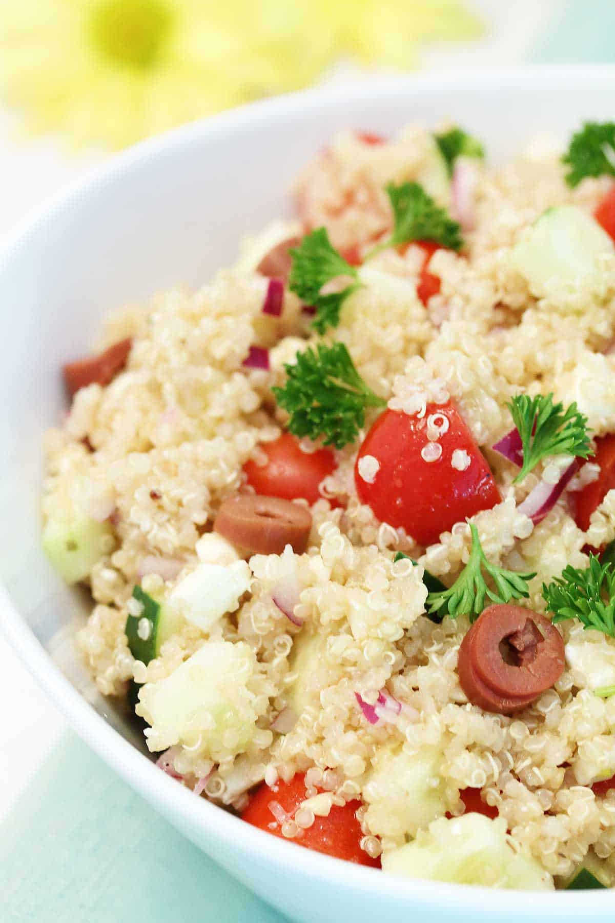 Mediterranean Quinoa Salad with feta in bowl.