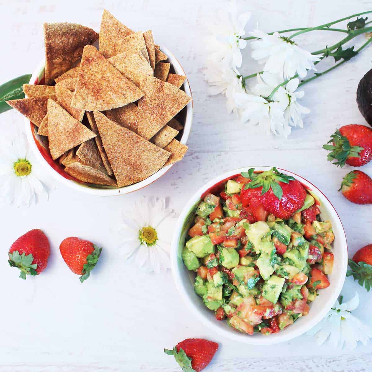 Overhead of strawberry salsa with cinnamon chips.