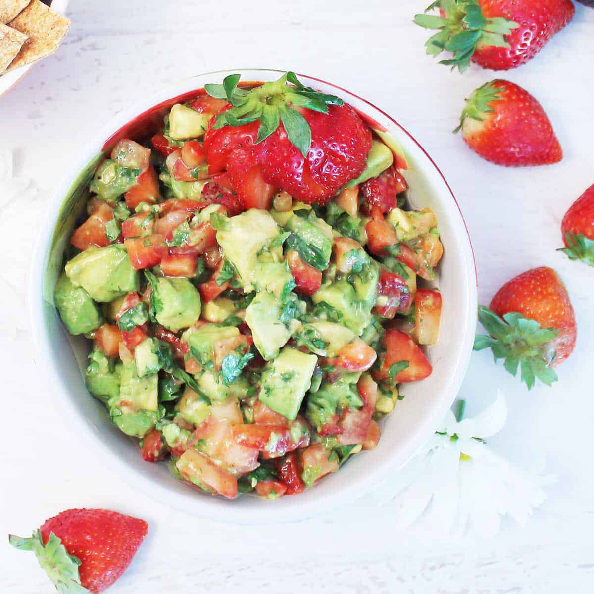 Overhead of Strawberry salsa with avocados in bowl.