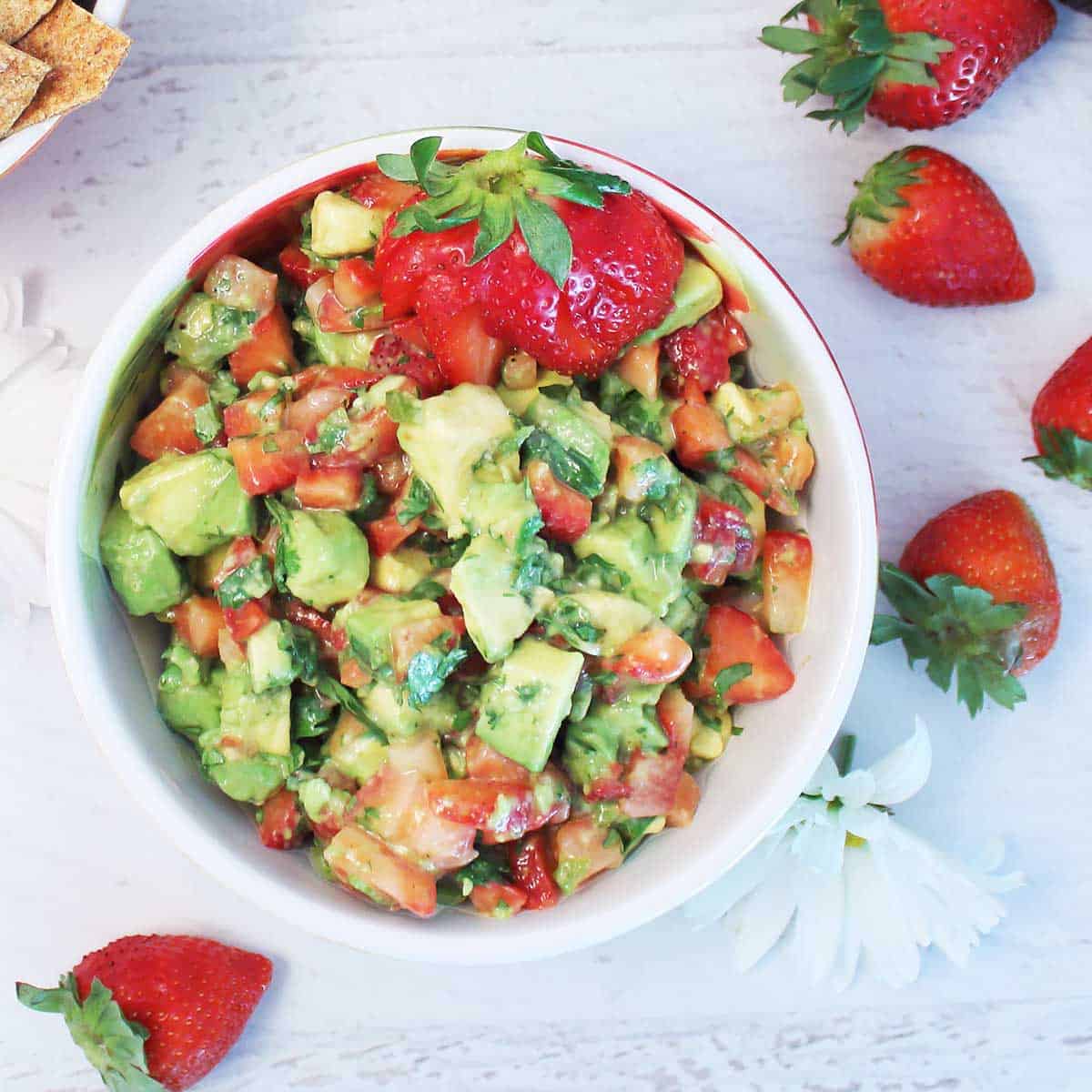 Overhead of mixed strawberry salsa with avocados.