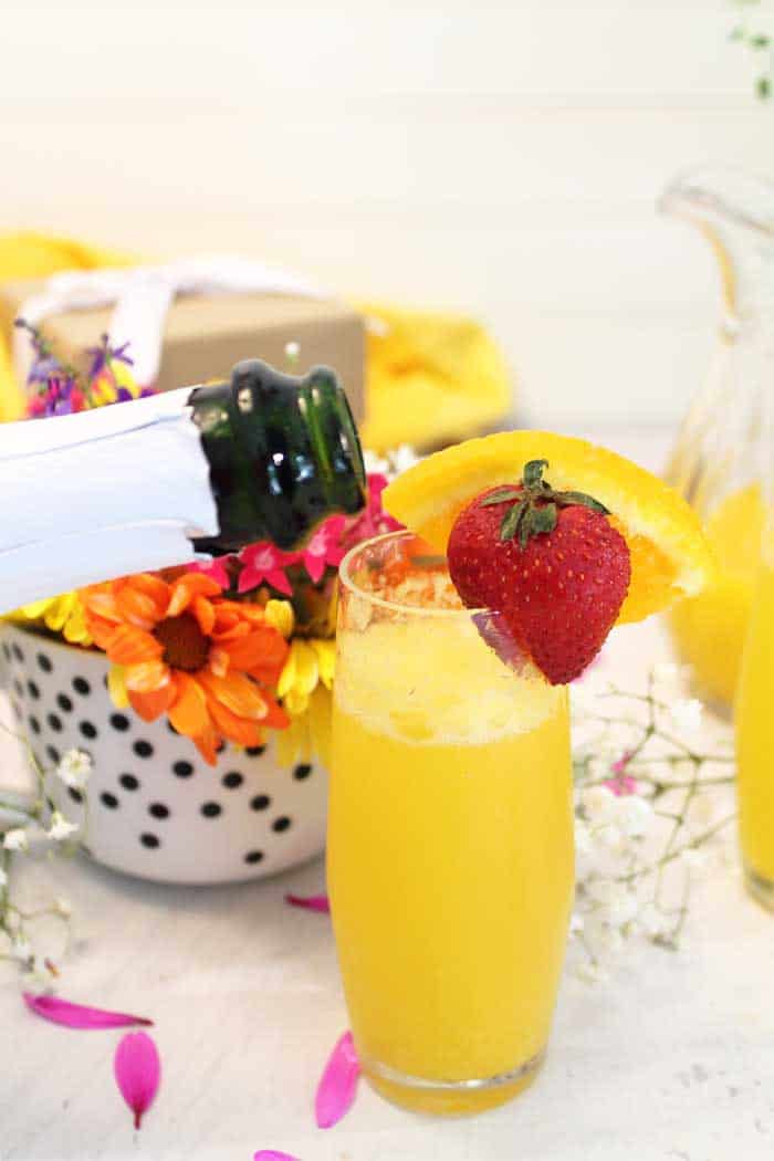 Sparkling Mimosas pouring champagne | 2 Cookin Mamas