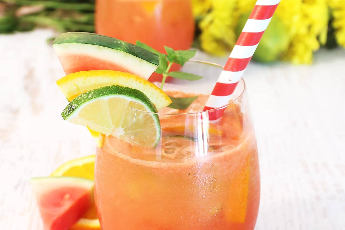 Closwup of top of cocktail with garnishes.