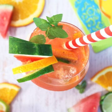 Overhead closeup of white sangria with fruit around it.