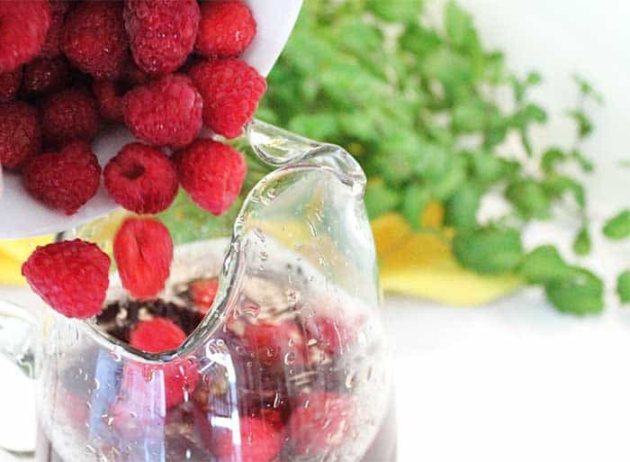 Raspberry Mint Iced Tea adding raspberries