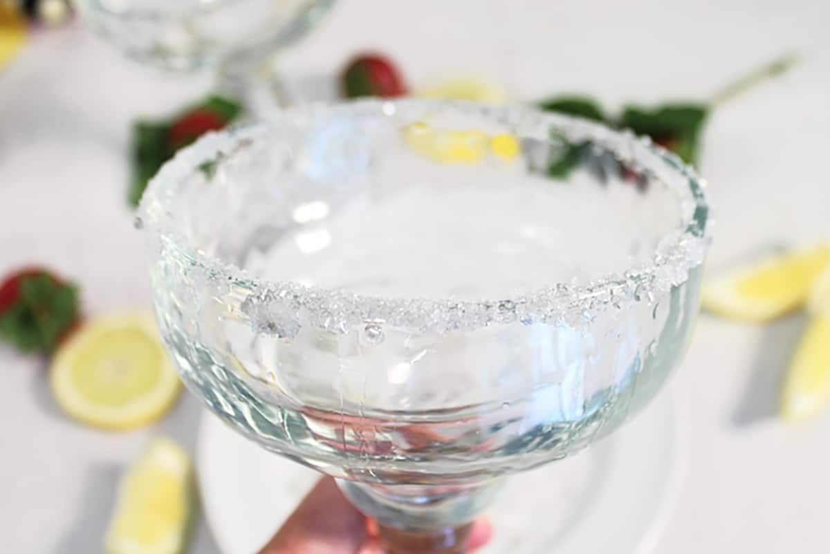 Closeup of sparkling sugar rim on margarita glass.