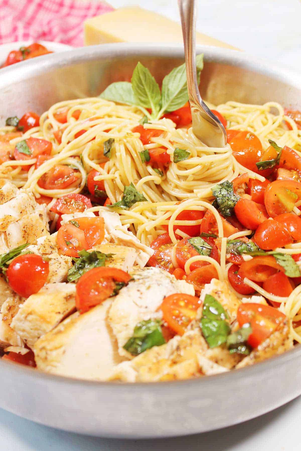 Swirled pasta with bruschetta sauce.