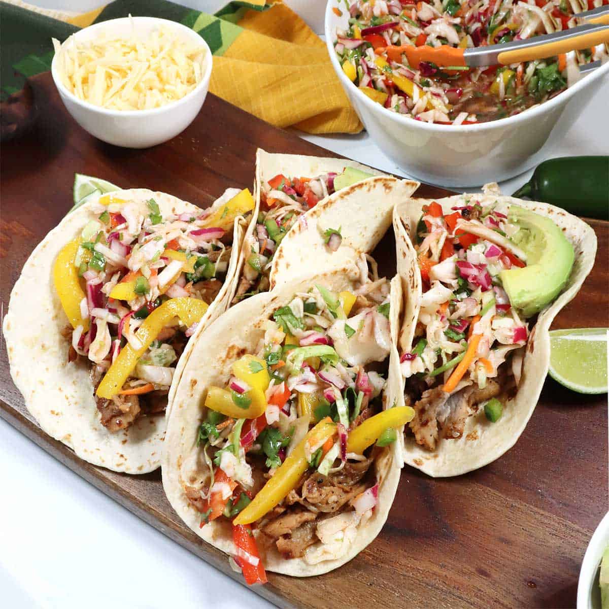 Korean Pork Tacos on tortillas with crispy slaw in back.