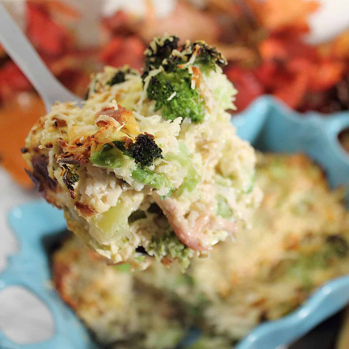 Spoonful of cheesy chicken broccoli casserole.