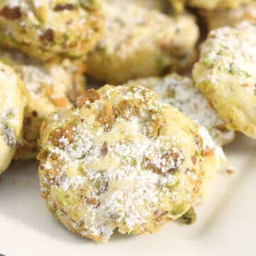 Closeup of pistachio cookie on plate.