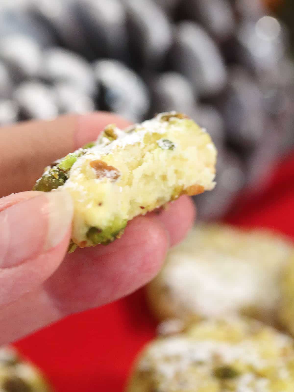 Whipped shortbread cookie with bite out of it.