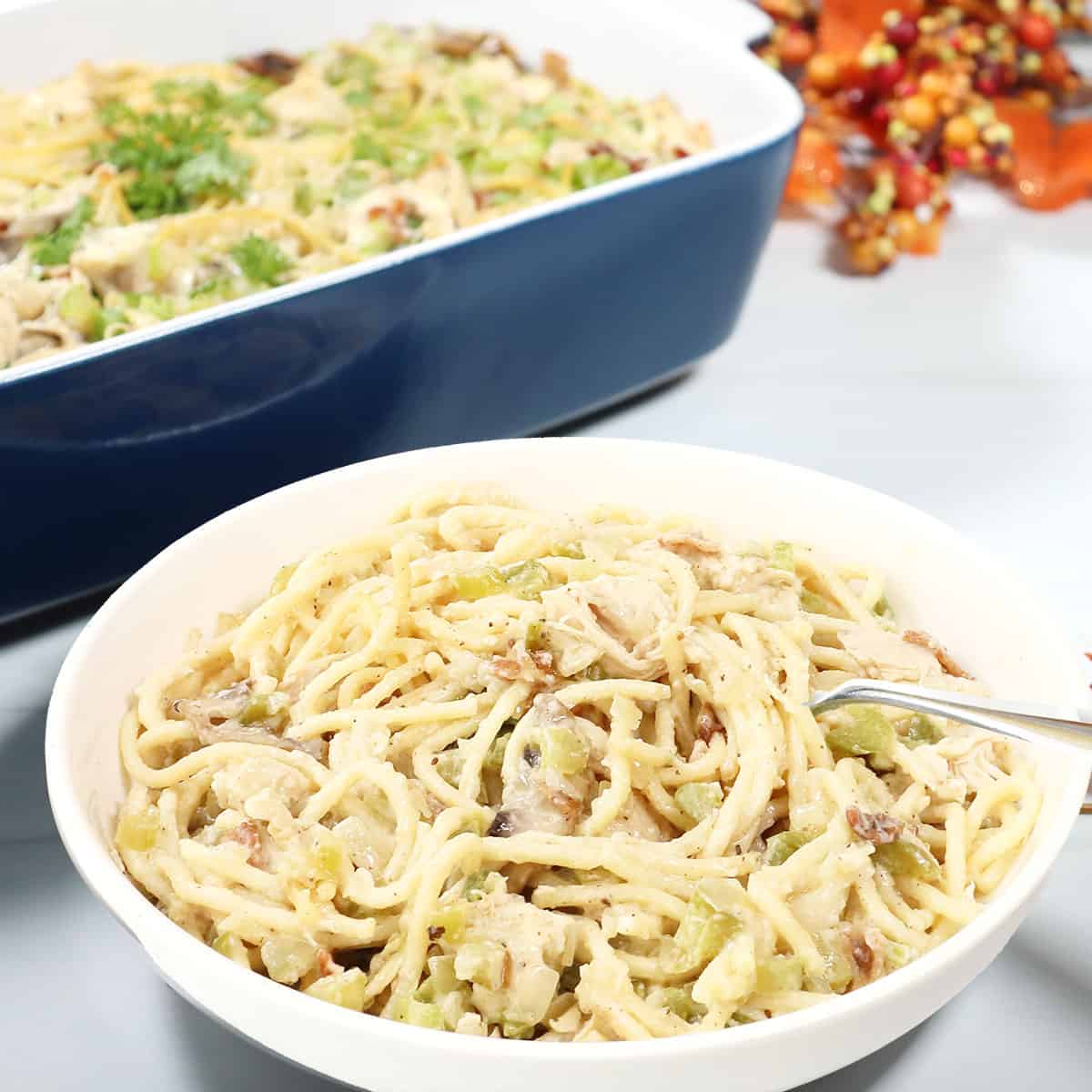 Dish of Turkey Tetrazzini in front of casserole.