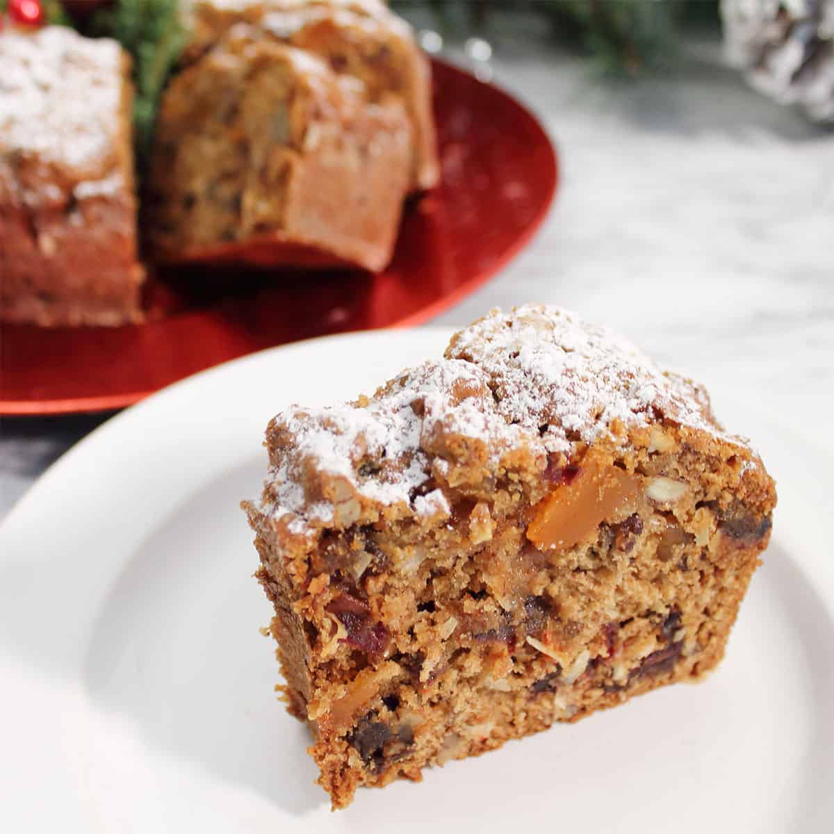 Closeup of slice of applesauce fruit cake.