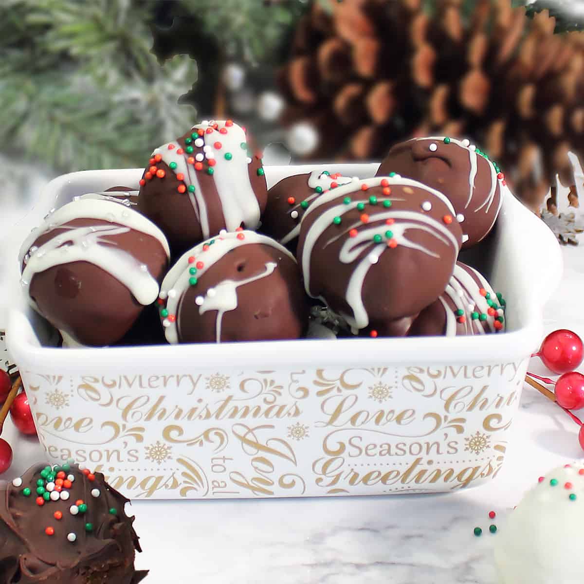 Gingerbread truffles in white Christmas dish.