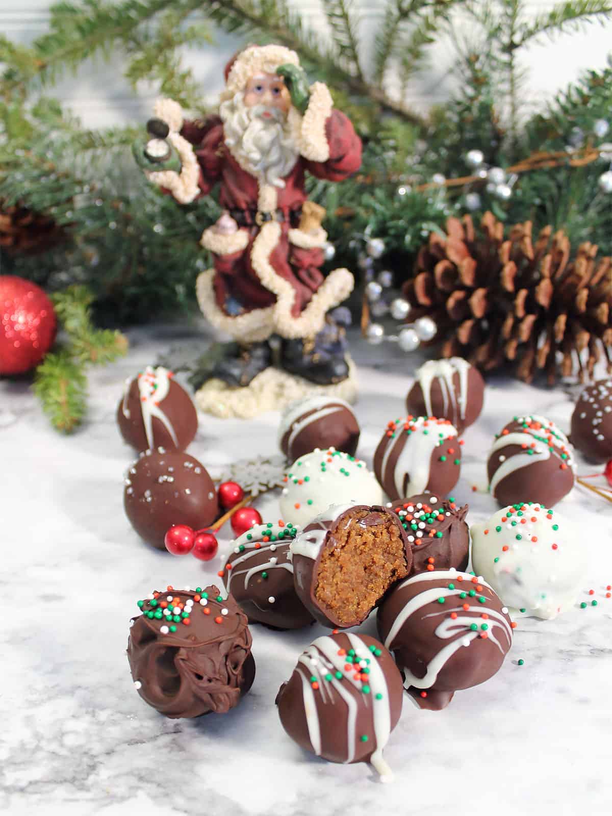 Pile of gingerbread truffles on table.