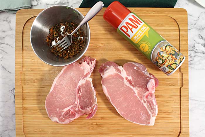 Easy Air Fryer Pork Chops ingredients on cutting board.