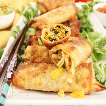 Halved egg roll on top of platter.