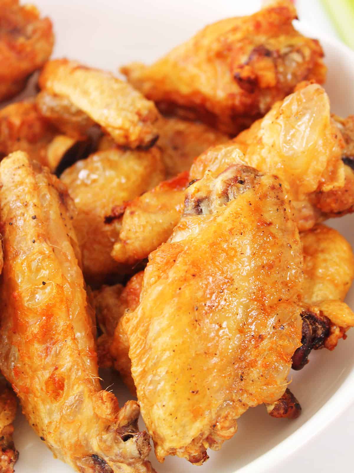 Closeup of super crispy air fryer chicken wings.