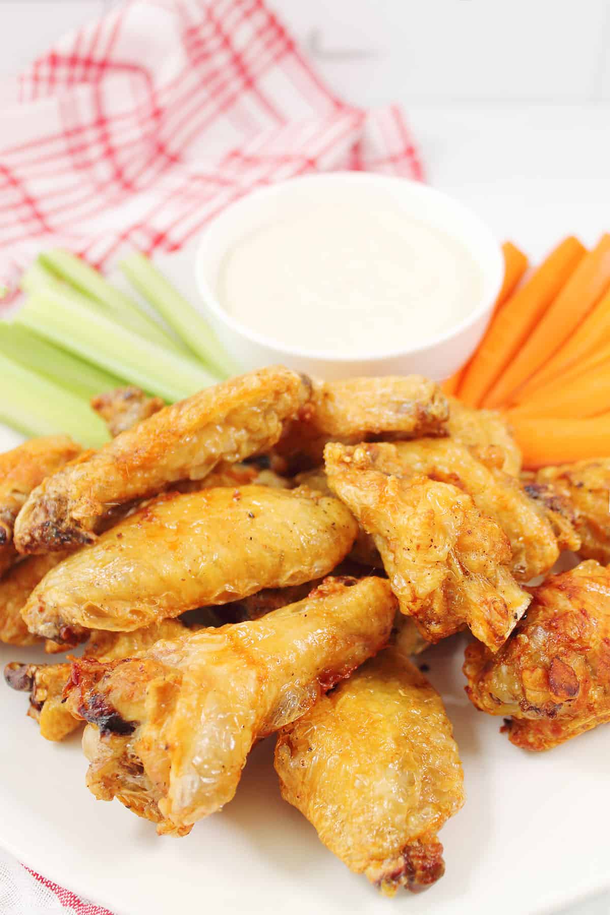 Super crispy air fryer chicken wings with celery, carrots, and bleu cheese dressing.