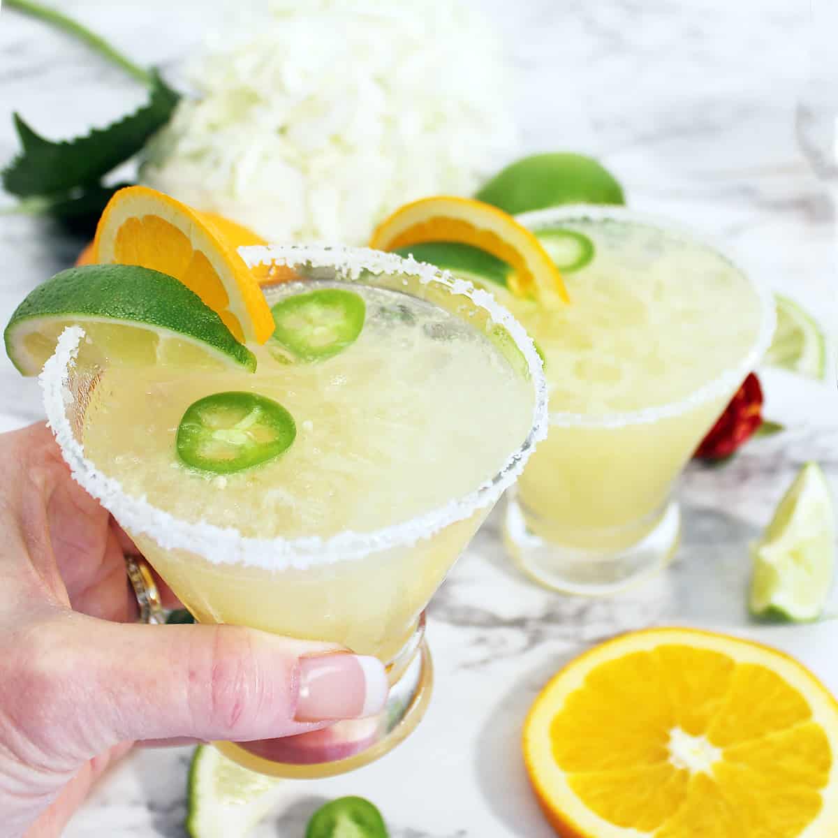 Holding Texas Margarita and toasting.