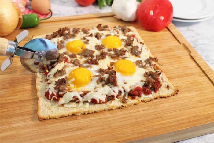 Shakshuka Breakfast Pizza slicing