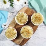 Baked Mac and Cheese in ramekins on wooden board square
