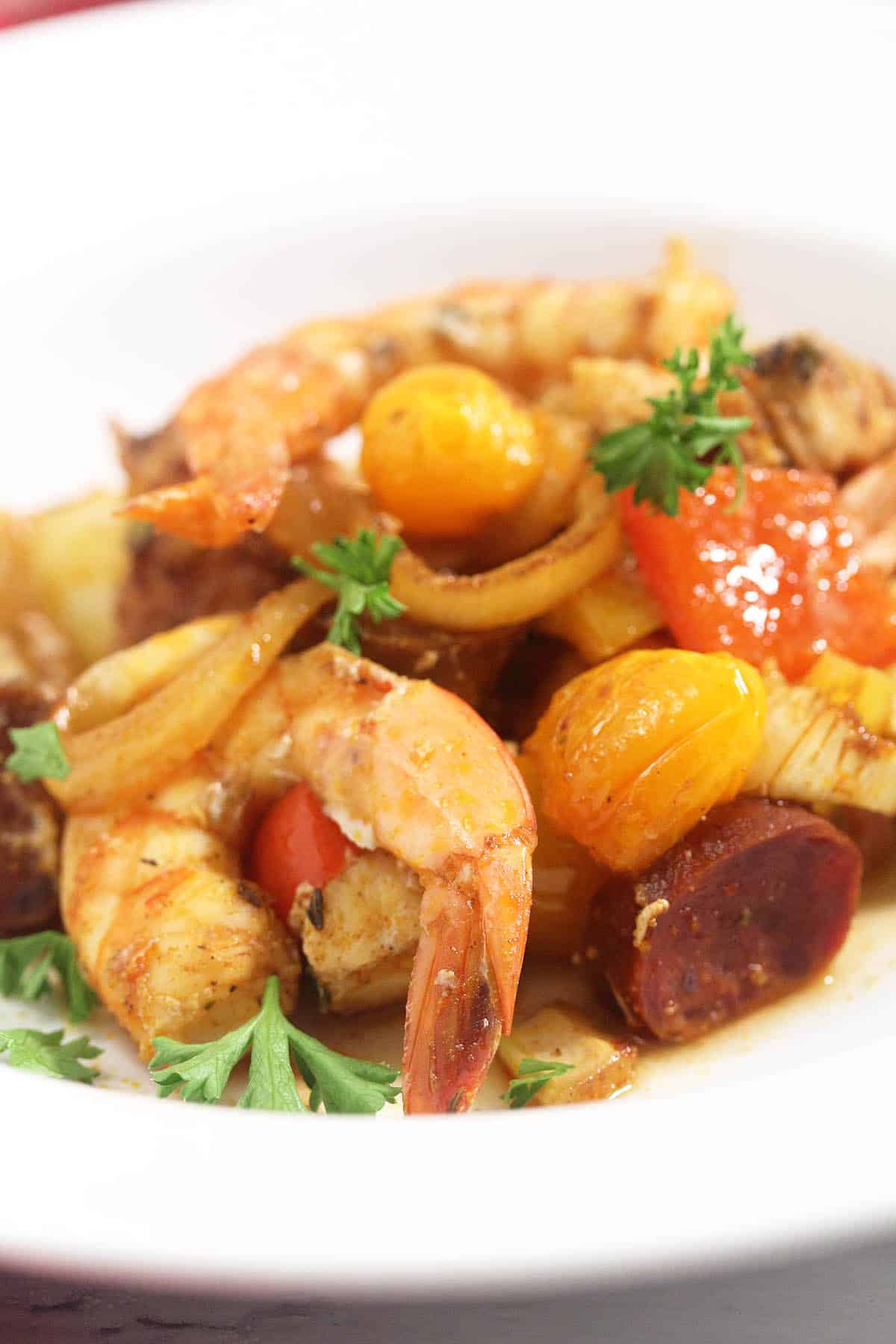Closeup of plated creole sheet pan dinner.