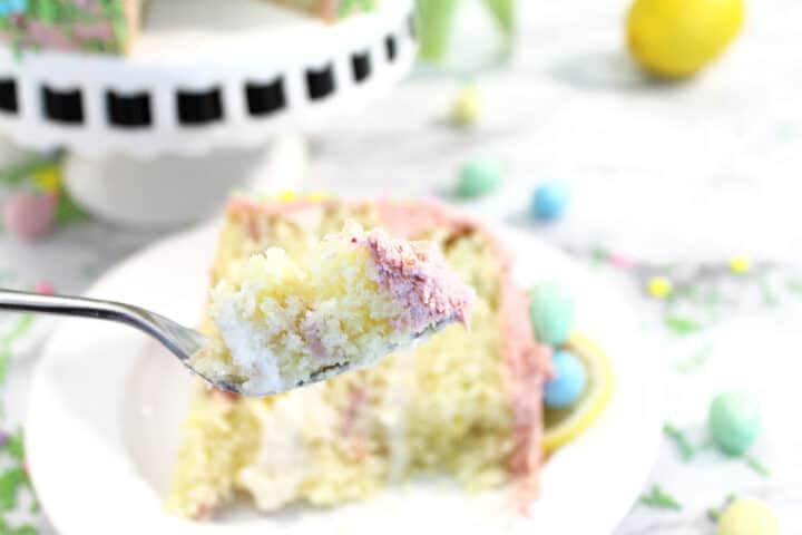 A bite of strawberry lemon cake on a fork.