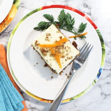 Overhead of single slice on plate on top of spring colored napkins.