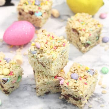 Wider view of stacked treats with candy and marshmallows around them.