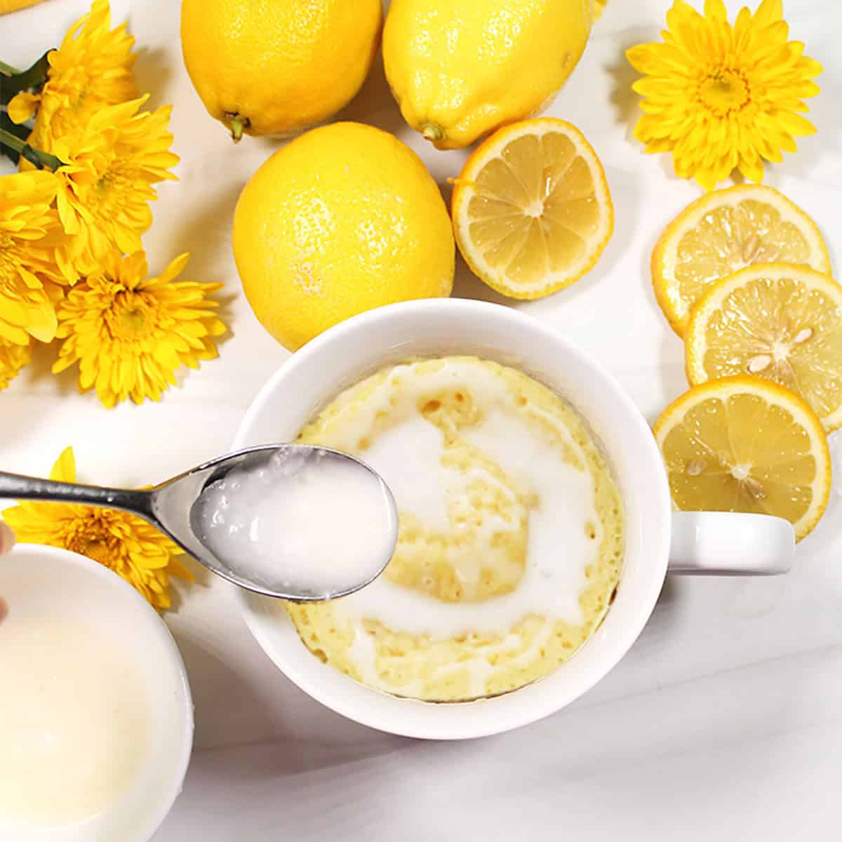 Microwave lemon Mug Cake with lemon drizzle.
