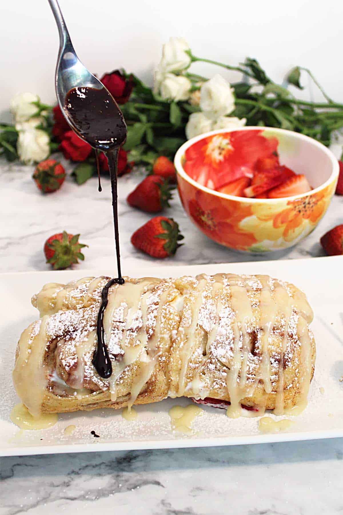 Drizzling roll with melted chocolate.