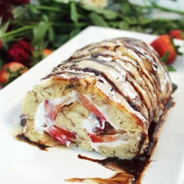 Showing inside of cut strawberry roll.