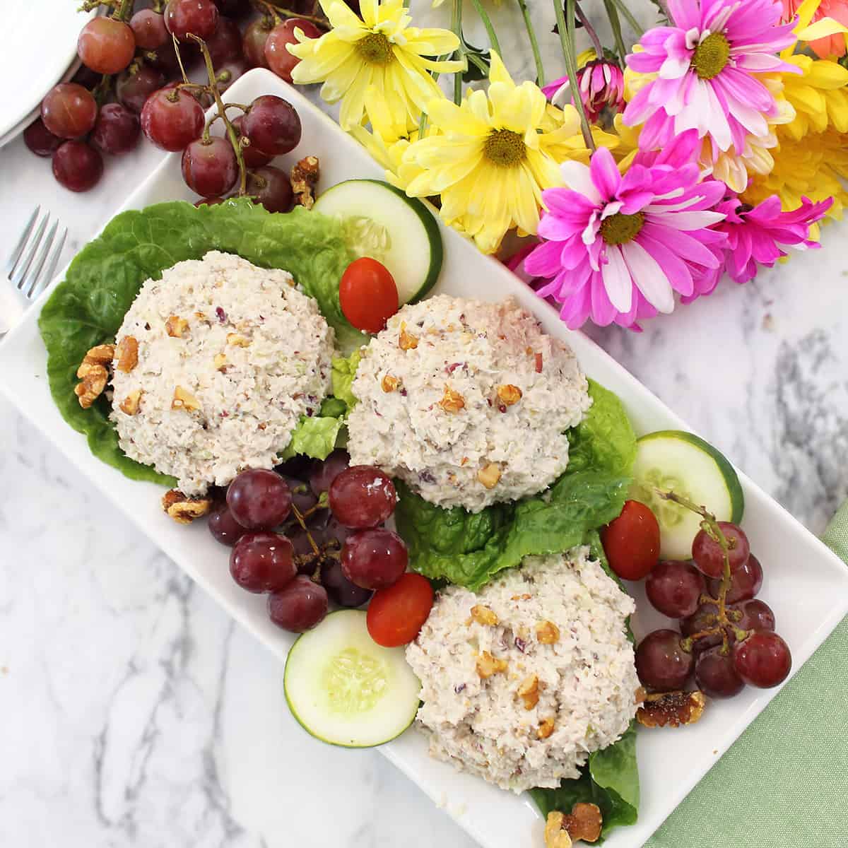 Three scoops of chicken and grapes salad overhead.