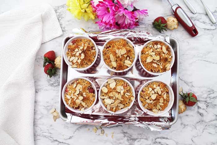 Baked ramekins on foil lined cookie sheet.