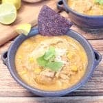 Single bowl of chicken chili with corn chip garnish.