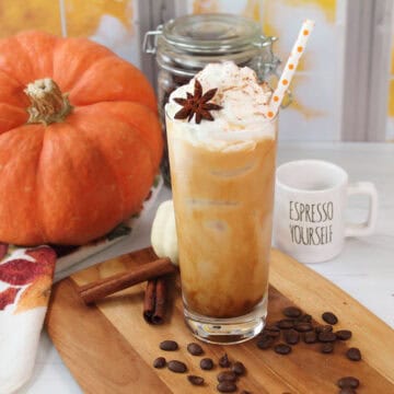 Garnished Iced Pumpkin Spice Latte with straw.