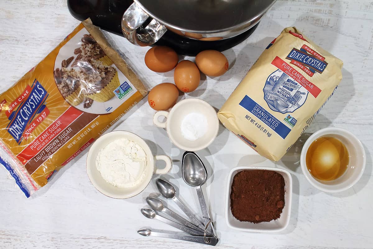 Ingredients for roll cake on white table.