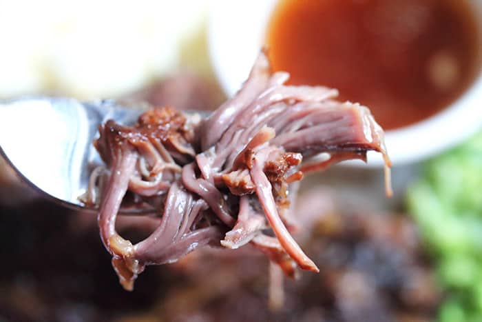 A bite of moist, fall off the bone beer braised short ribs.