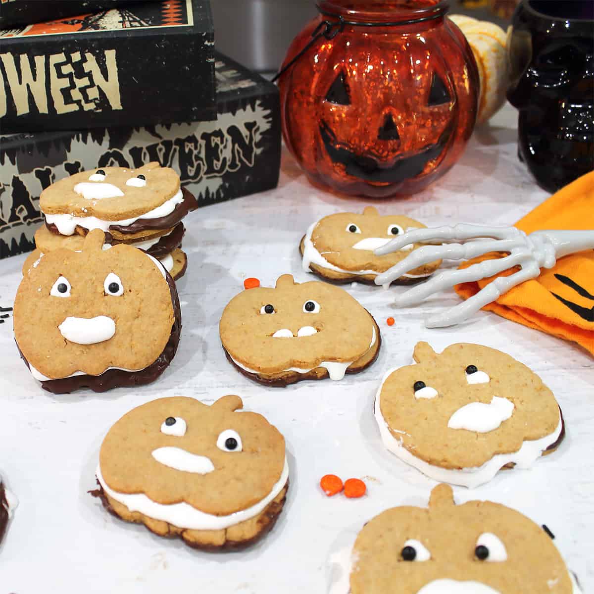 S'mores sandwich cookies on white table.