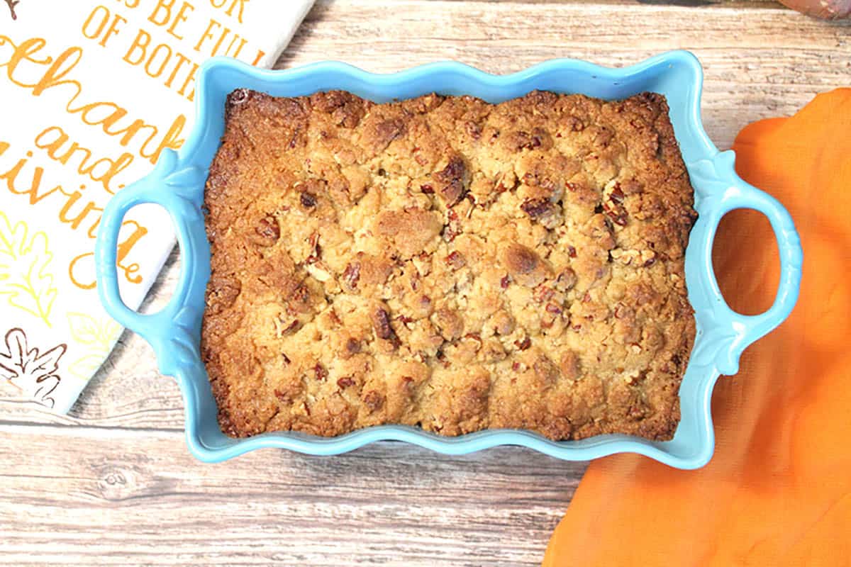 Baked casserole overhead on wooden table.