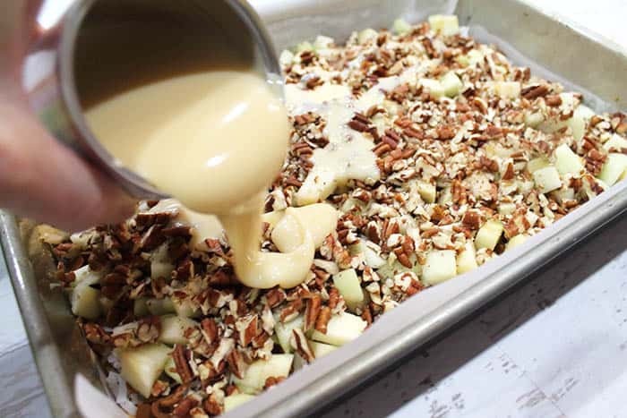 Closeup of pouring condensed milk.