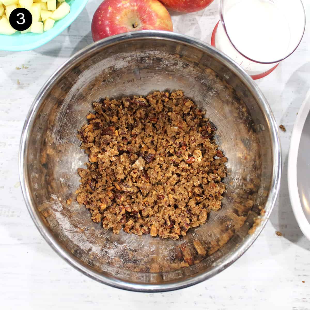 Showing texture of pecan streusel in mixing bowl.