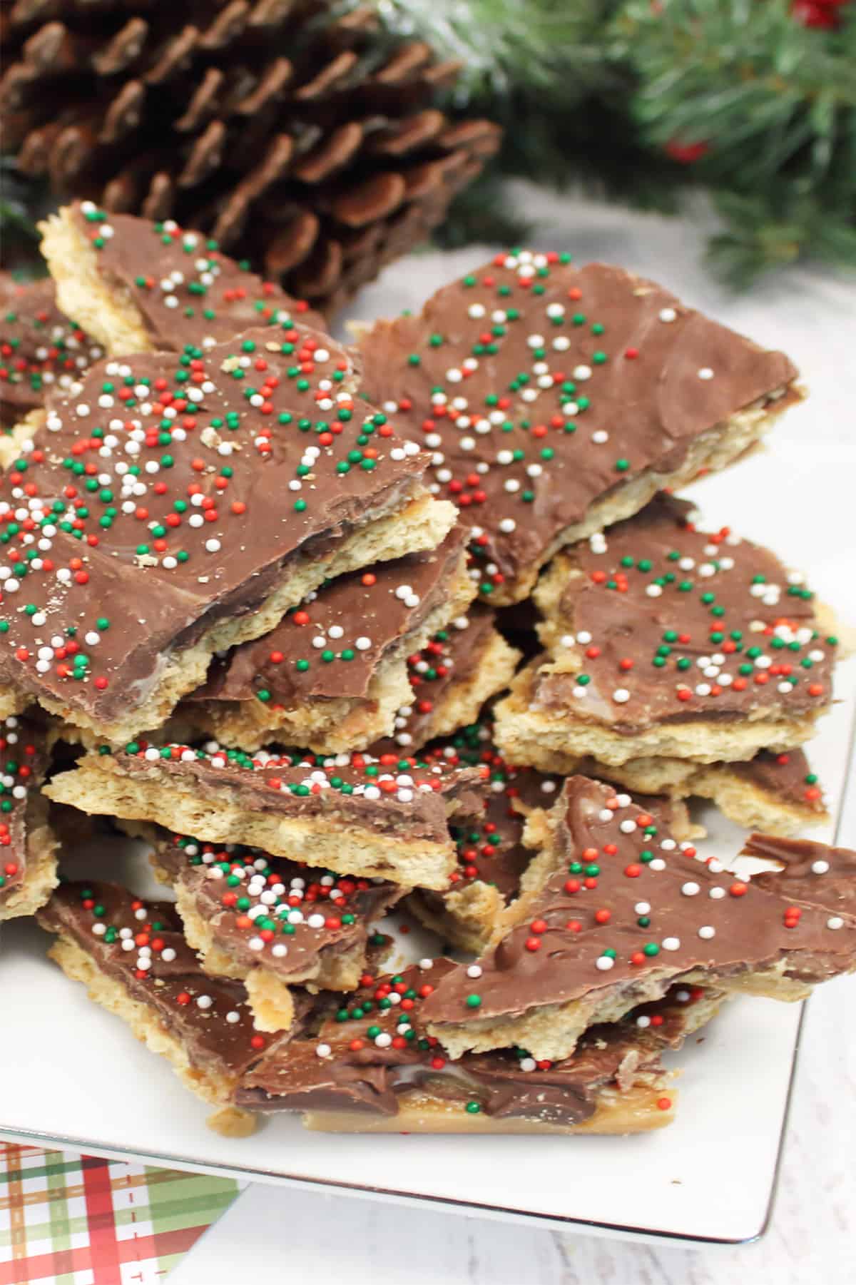Plateful of S'mores Christmas Crack Toffee with sprinkles.