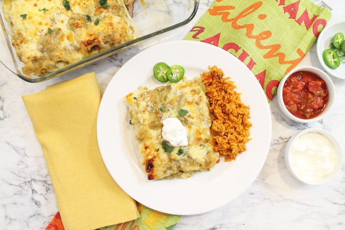 Overhead of plated serving with smothered burrito casserole in background.