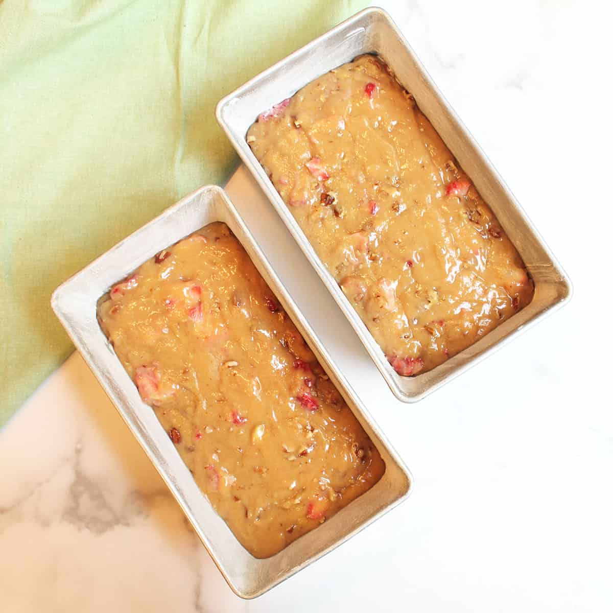 Batter in loaf pans ready to bake.