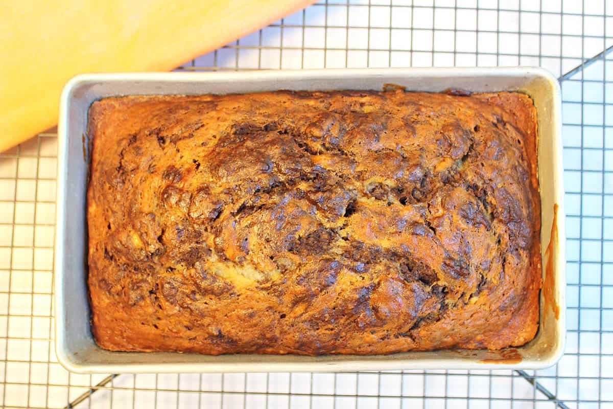 Bread cooling in pan on wire rack