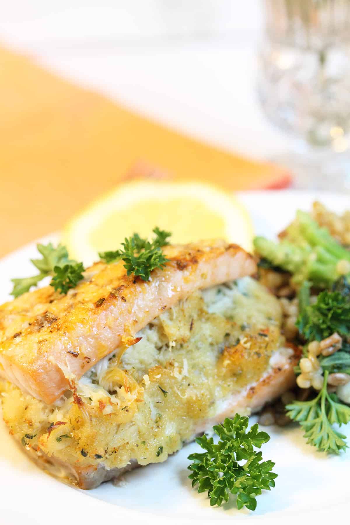 Closeup of crab stuffing in plated stuffed salmon.