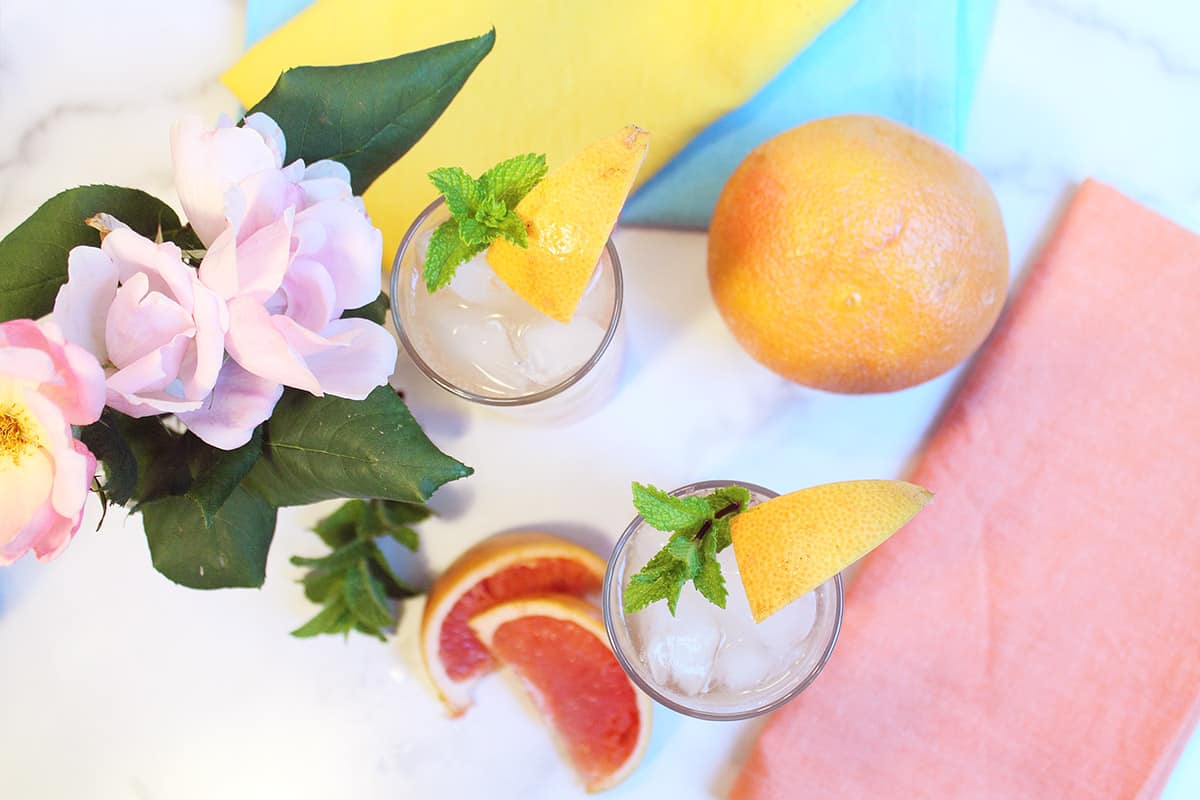Overhead of 2 garnished cocktails.